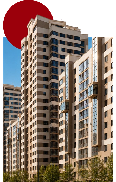 Conjunto de edifícios residenciais e comerciais de vários andares, com árvores na parte inferior e um elemento circular vermelho ao fundo. Representa condomínios que precisam de apoio para organizar suas rotinas administrativas, financeiras e contábeis. A Vilac Contabilidade oferece administração e assessoria condominial para auxiliar síndicos e condomínios na gestão de suas atividades e obrigações.